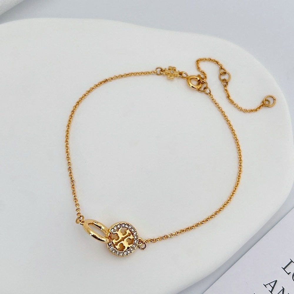 Tory Burch Elegant Gold Bracelet with Crystal Accents